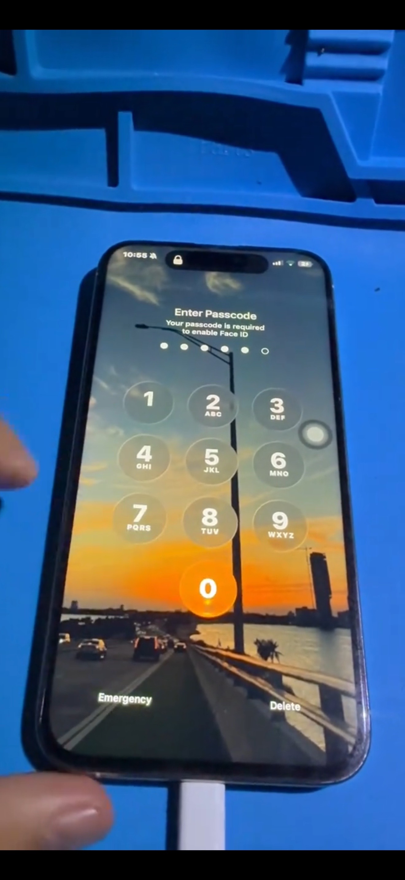 After repair: iPhone display restored and working with passcode screen visible