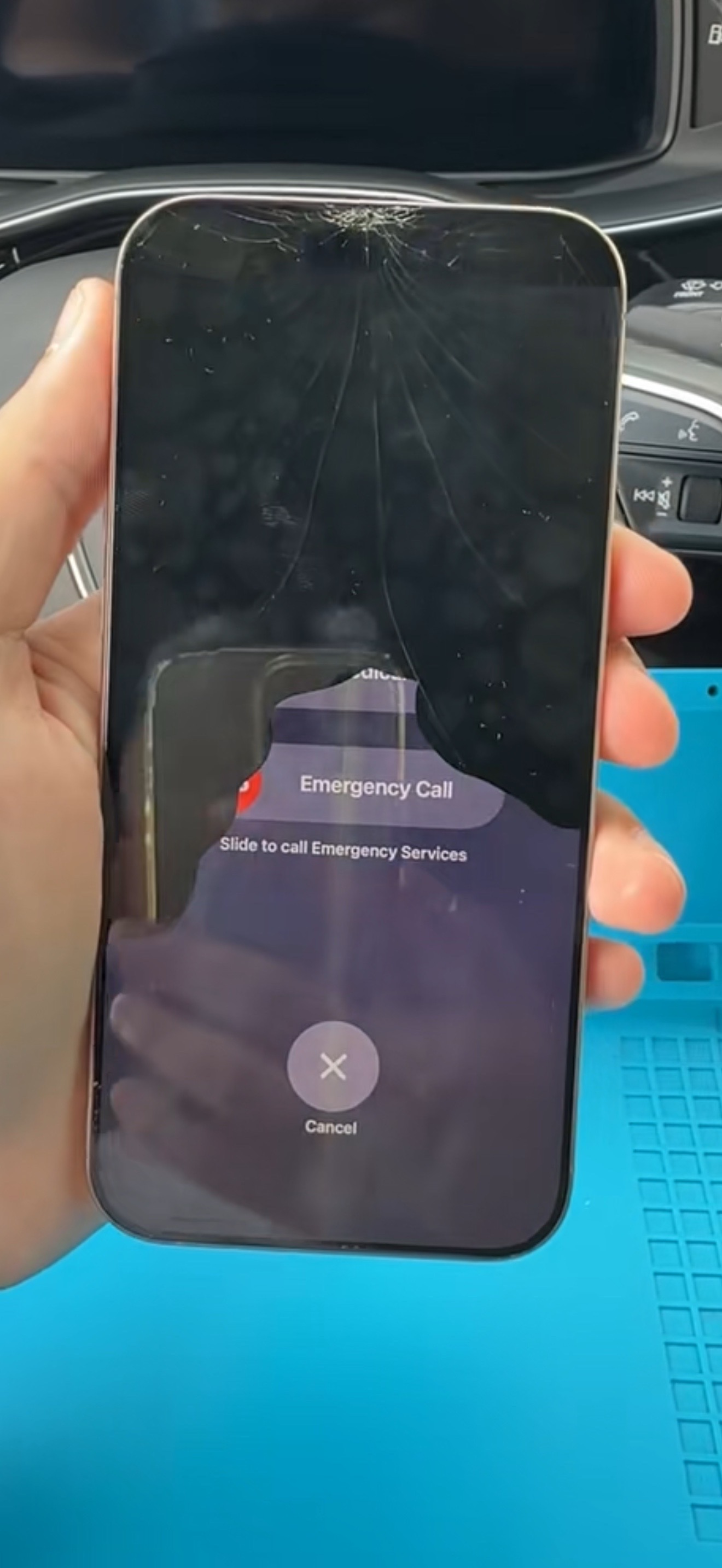 Before repair: cracked iPhone screen with damaged top glass